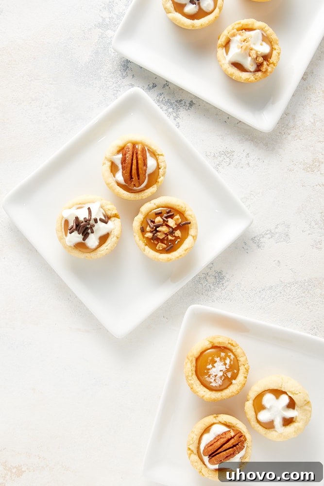 overhead view of Mini Caramel Tarts on square white plates