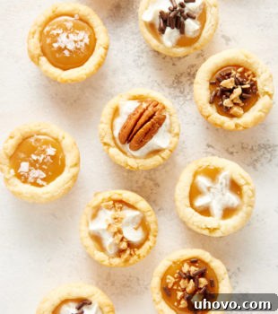 overhead view of Mini Caramel Tarts on a white and gray surface