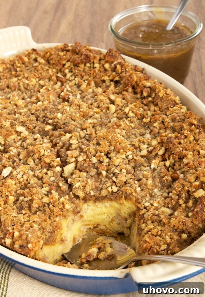 Decadent Praline Bread Pudding with a rich Caramel-Pecan Sauce, packed with pecans, brown sugar, and cinnamon. A perfect dessert for any occasion.