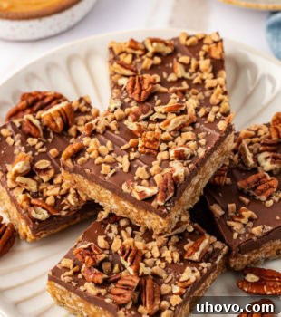 A delicious chocolate peanut butter cereal bar on a white plate, ready to be enjoyed.
