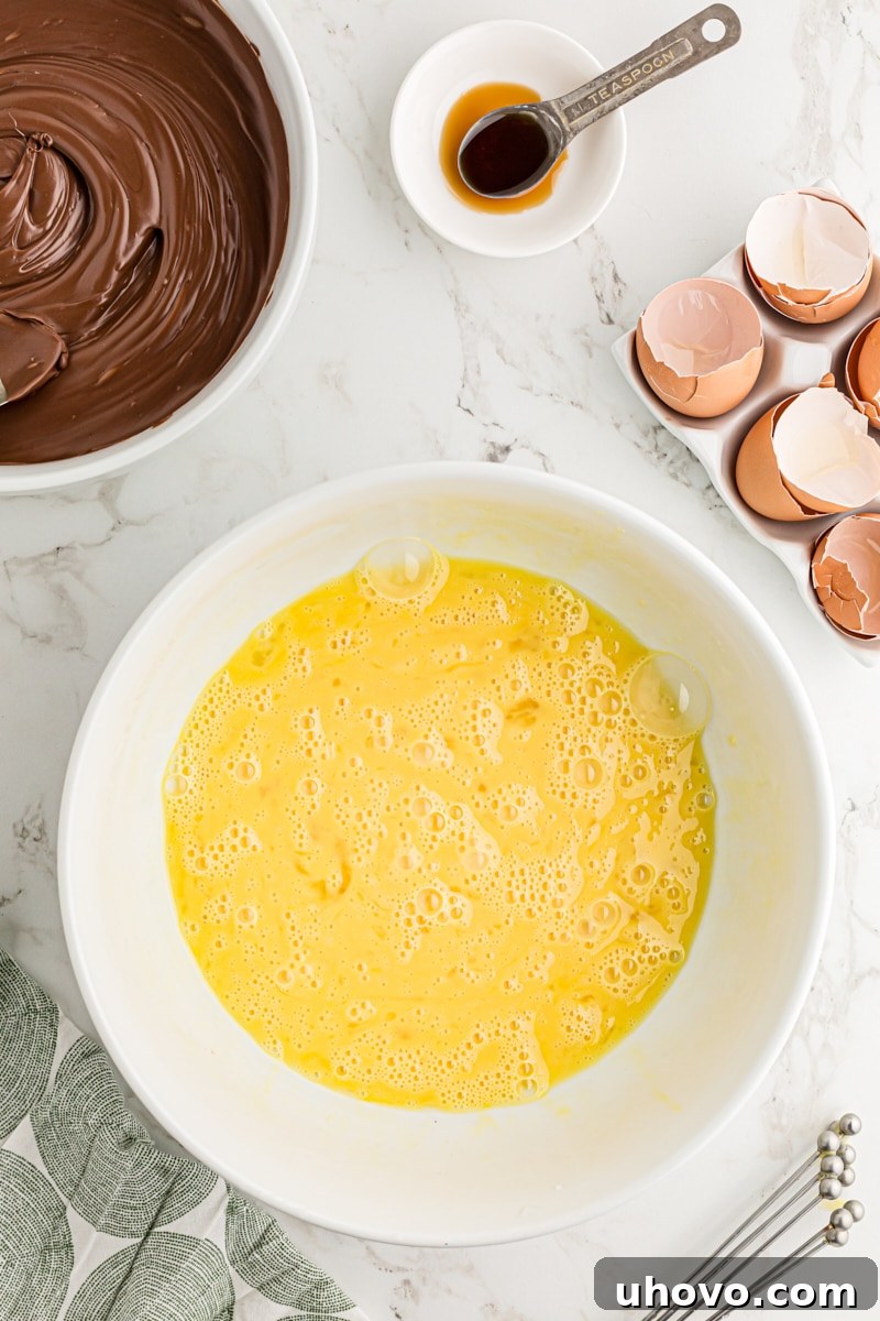 Beaten eggs in mixing bowl