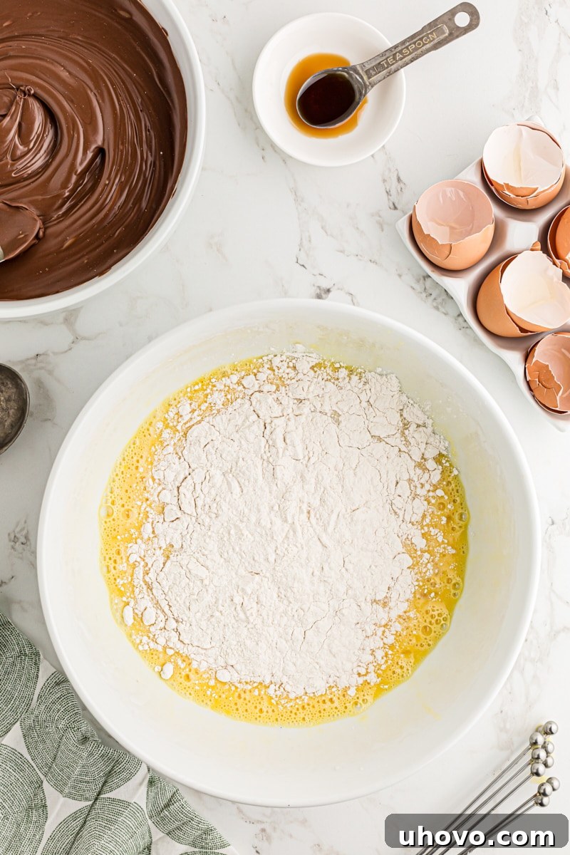 Flour added to mixing bowl of batter