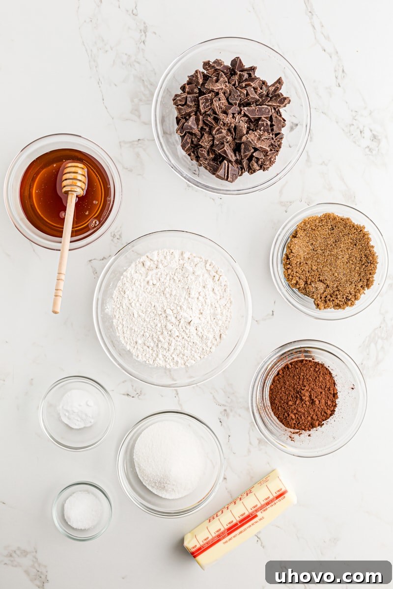 Overhead view of ingredients for Double Chocolate Brownie Cookies laid out on a marble surface