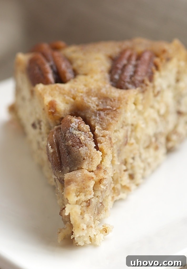 Rich Pecan Upside-Down Cake with a gooey caramel topping, perfect for any special occasion. Features crunchy pecans and a moist, tender crumb.