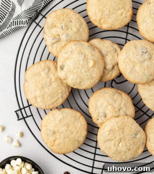 Overhead view of black and white chocolate chip cookies on wire rack