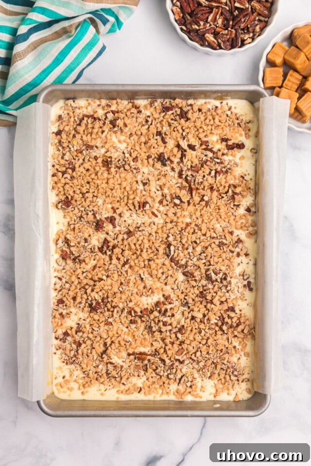 overhead view of caramel cheesecake bars assembled and ready to go into the oven
