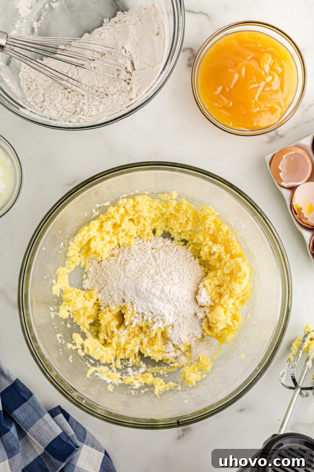 Overhead view of dry ingredients added to creamed butter and sugar
