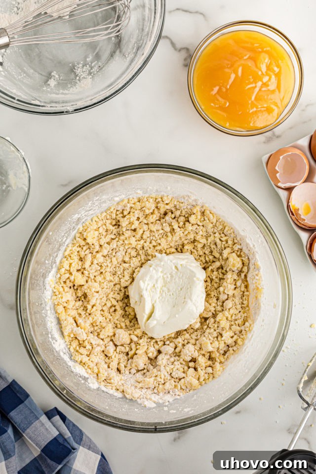 Overhead view of yogurt added to bowl of cake batter