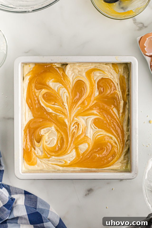 Overhead view of swirled lemon curd in cake batter