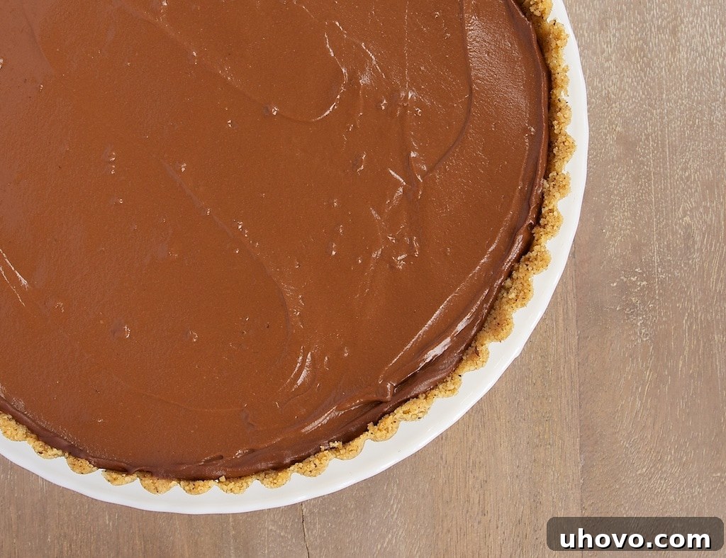 Chocolate Pudding Pie with Peanut Butter Filling is a cool, creamy favorite. Love that little peanut butter surprise inside!