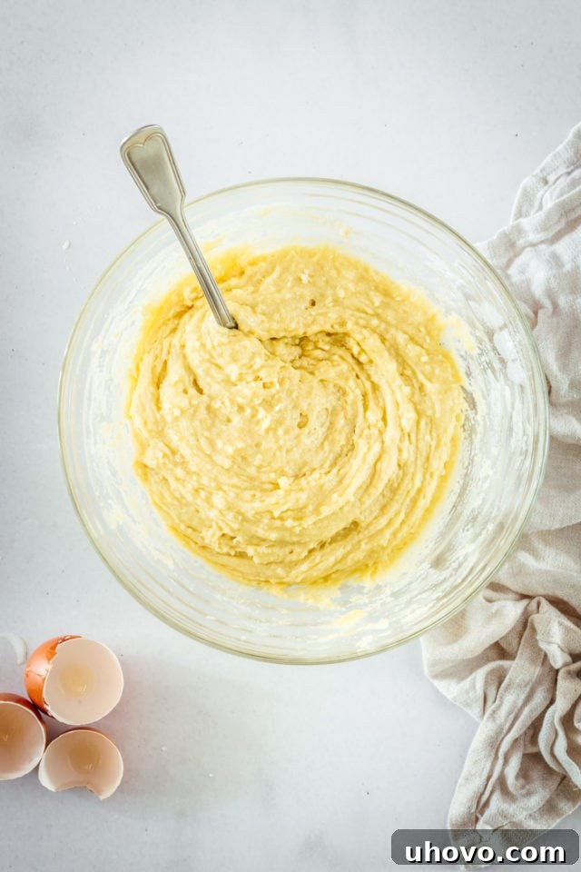 Overhead view of the fluffy muffin batter, perfectly mixed and ready for the next step.