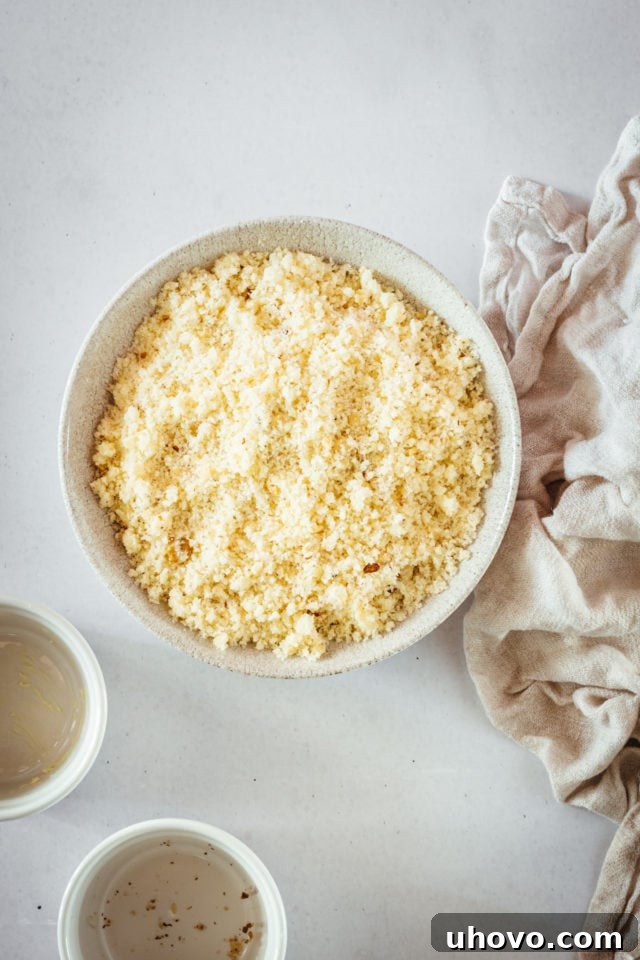 Overhead view of a perfectly crumbly muffin topping mixture in a bowl.