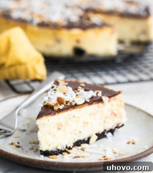 Slice of Chocolate Coconut Almond Cheesecake on a beige plate.