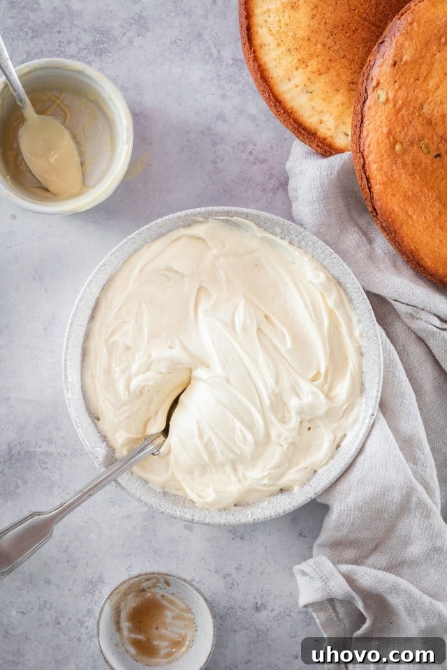 Overhead shot of the finished fluffy and smooth White Chocolate Frosting in a bowl, ready to use.