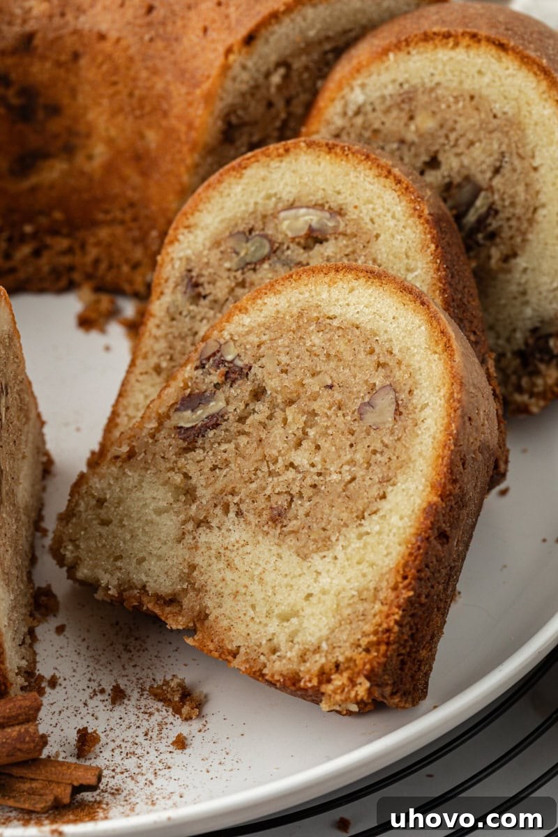 Close-up of moist cinnamon crown cake slices arranged on a white platter