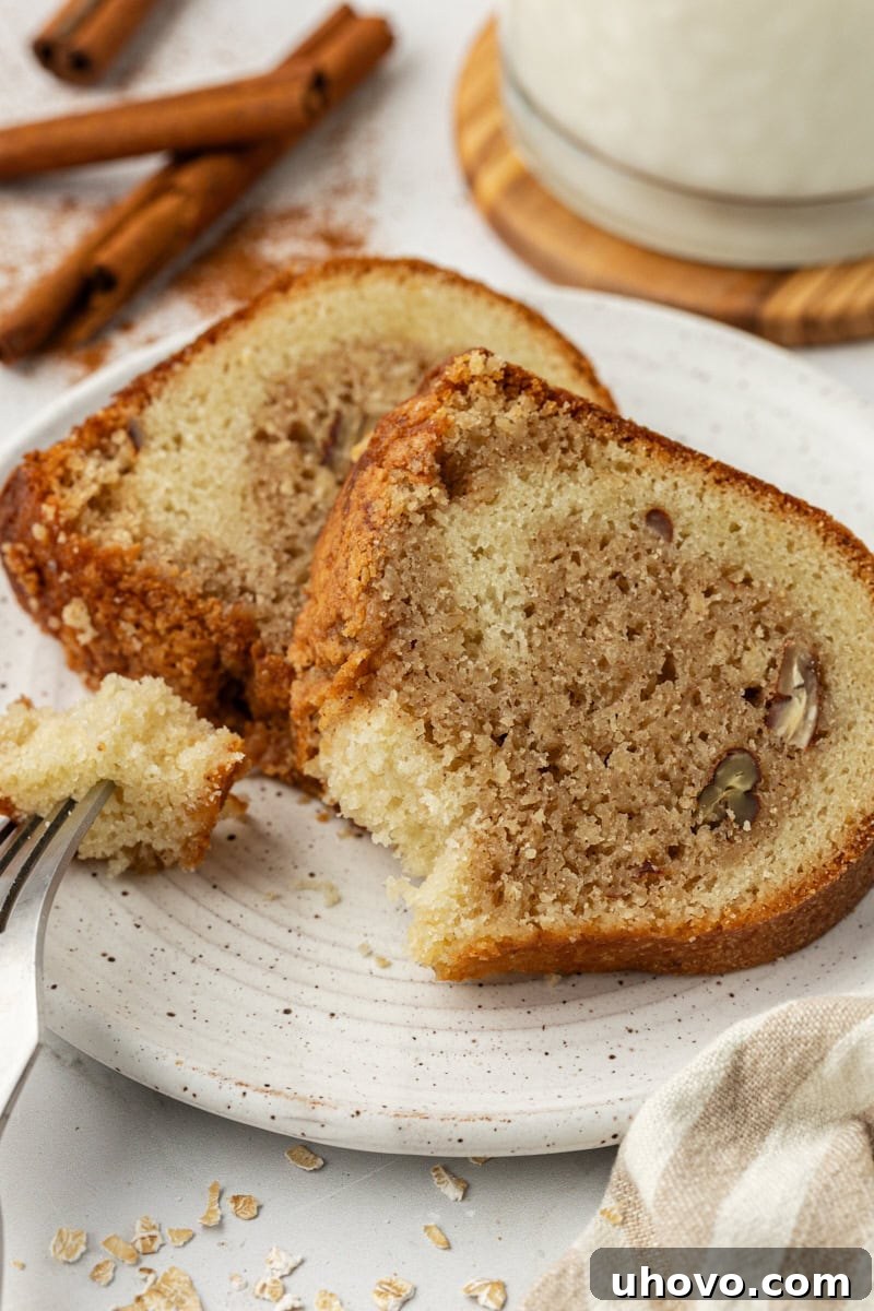 Two generous slices of cinnamon crown cake, showcasing the internal crown of spiced oats and nuts