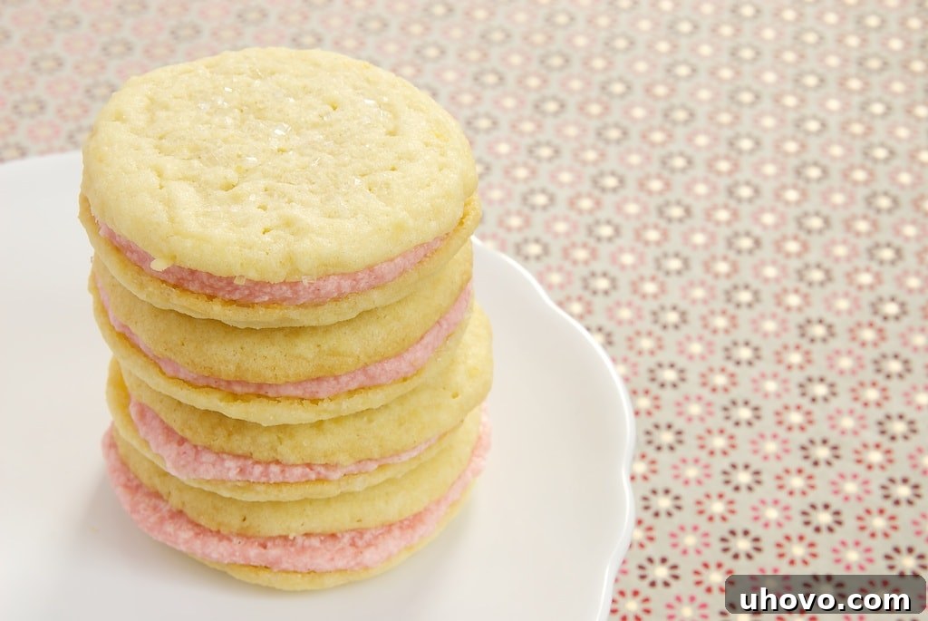 Sweet, tart, soft lemon cookies get sandwiched around a sweet strawberry filling for a lovely summer treat!