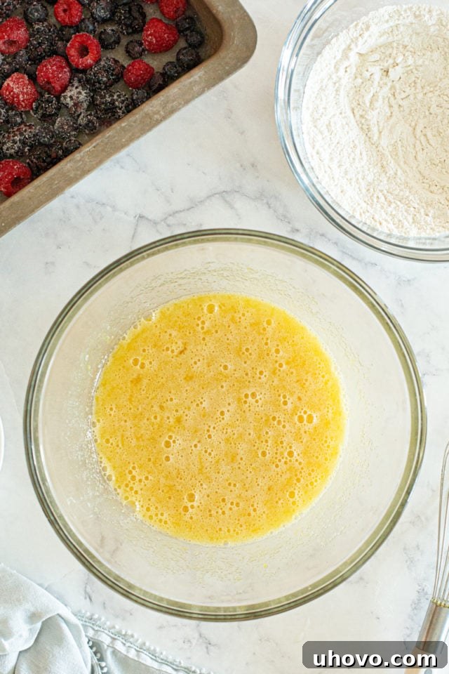 The wet ingredients, now expertly whisked into a smooth, emulsified mixture, showcasing their combined texture and color.