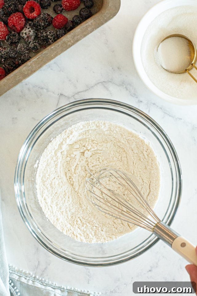 The same dry ingredients, now thoroughly whisked together in the bowl, creating a uniform mixture for the cake batter.