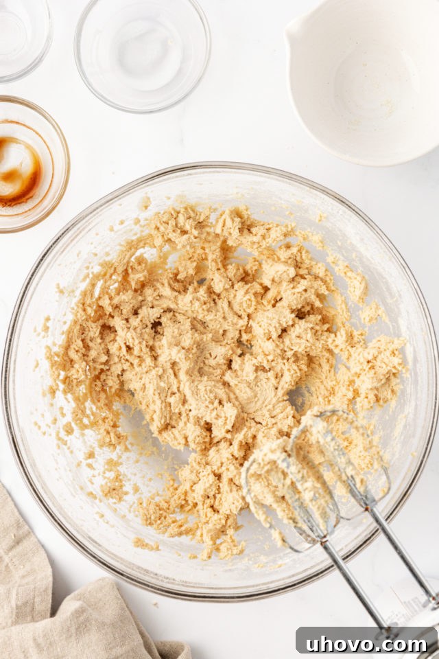 The finished tart crust dough in a glass mixing bowl, perfectly combined and ready for the tart pan.