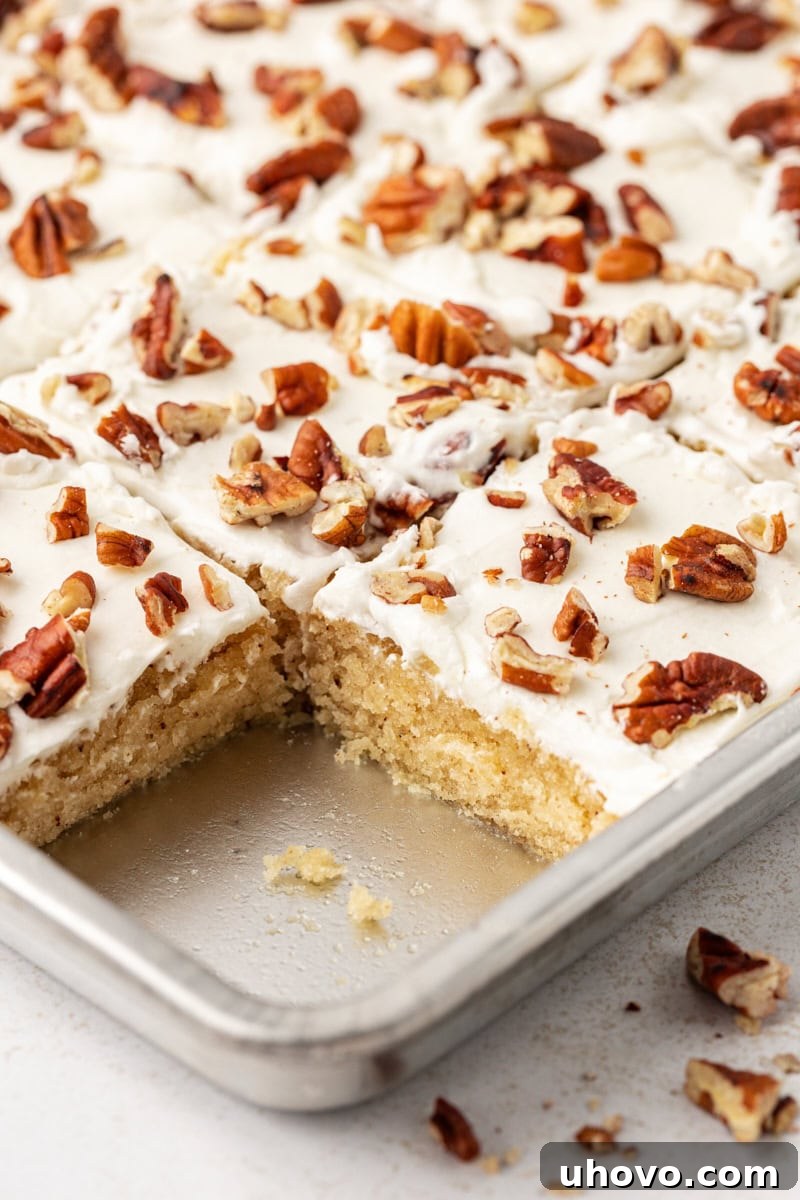 Pan of brown butter Texas sheet cake with one slice removed
