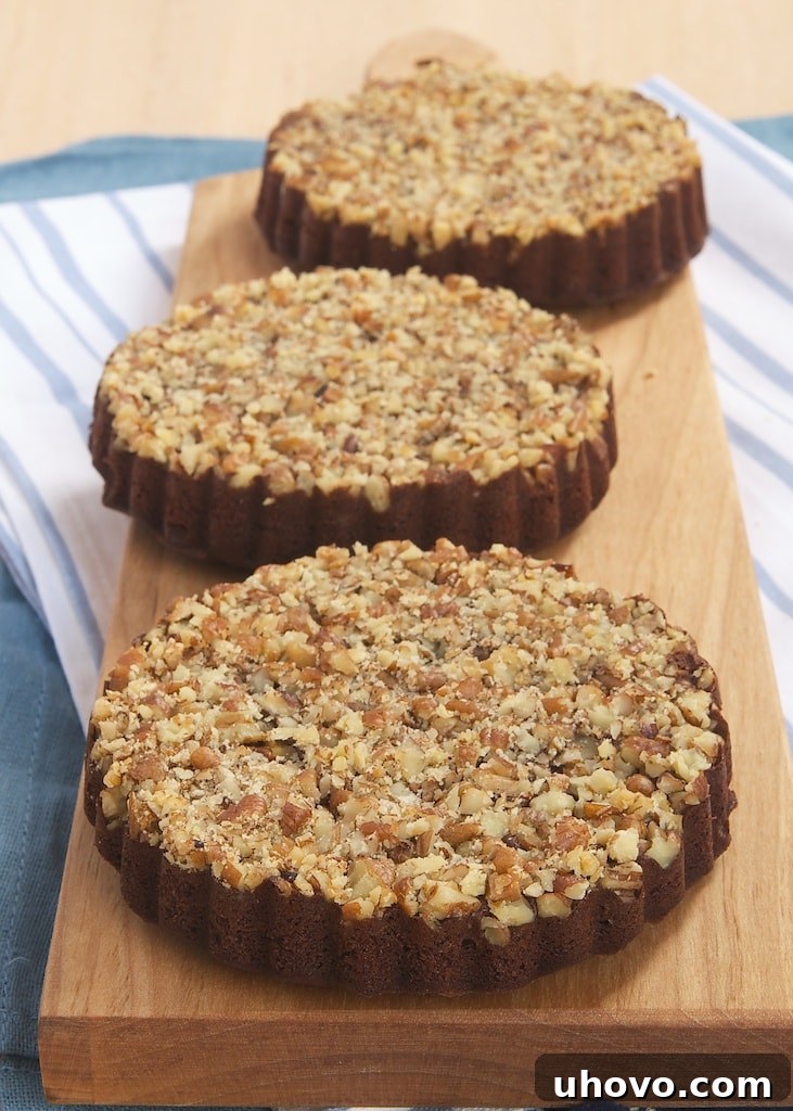 Rich brownies are baked on top of a layer of toasted pecans, then flipped over for a little bit of fancy with Upside-Down Pecan Brownie Tarts.