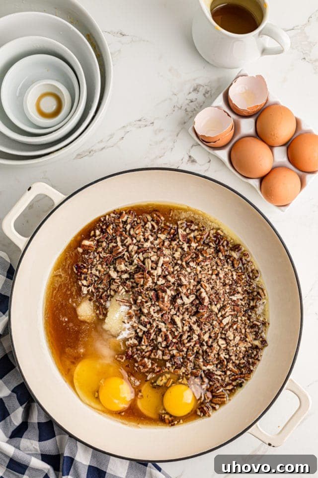 Mixing granulated sugar, corn syrup, melted butter, eggs, chopped pecans, and vanilla extract in a saucepan to create the pecan pie filling.