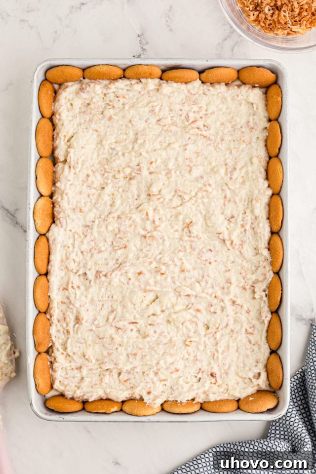 Overhead view of pudding layer for coconut pie bars