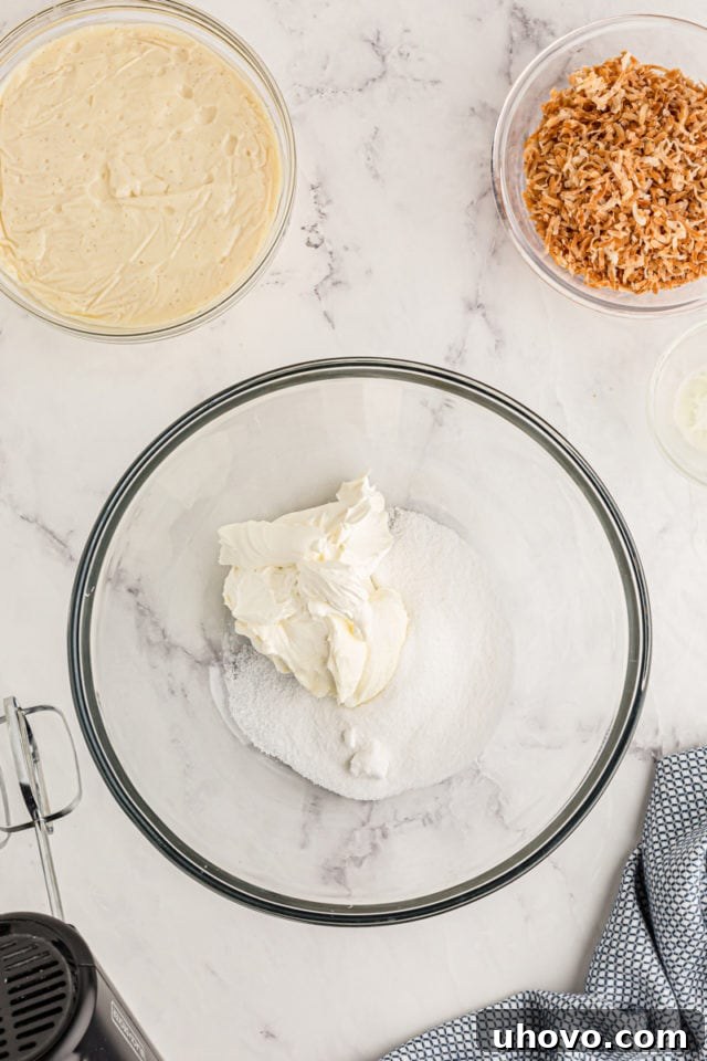 Overhead view of cream cheese and sugar in bowl