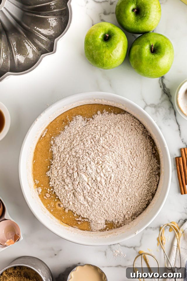 dry ingredients added to wet ingredients for apple spice cake