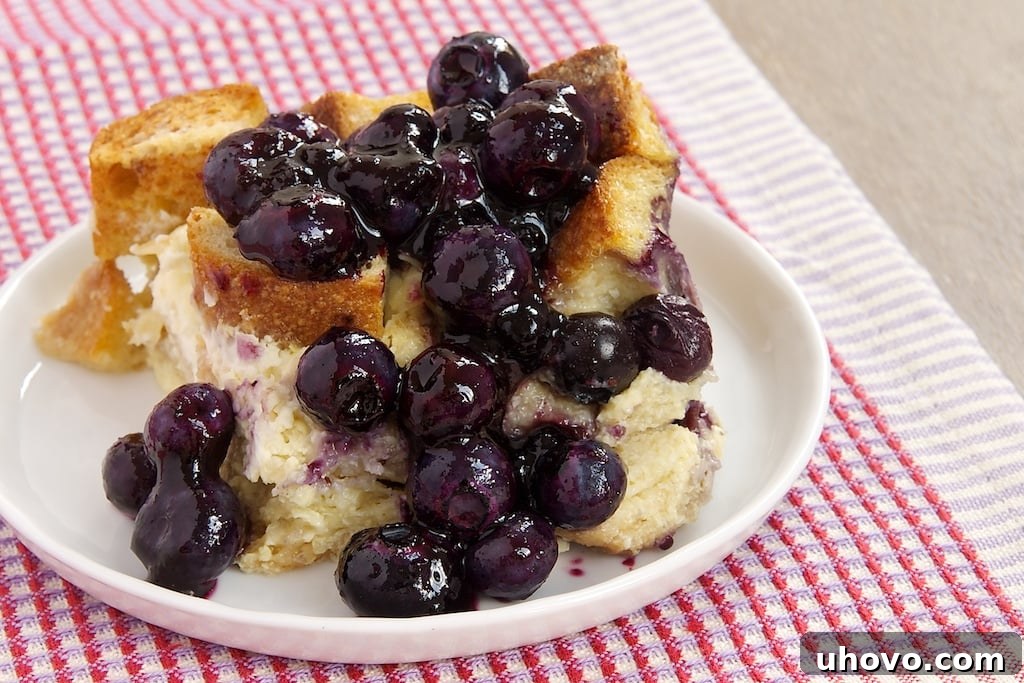 Blueberry bread pudding on white plate