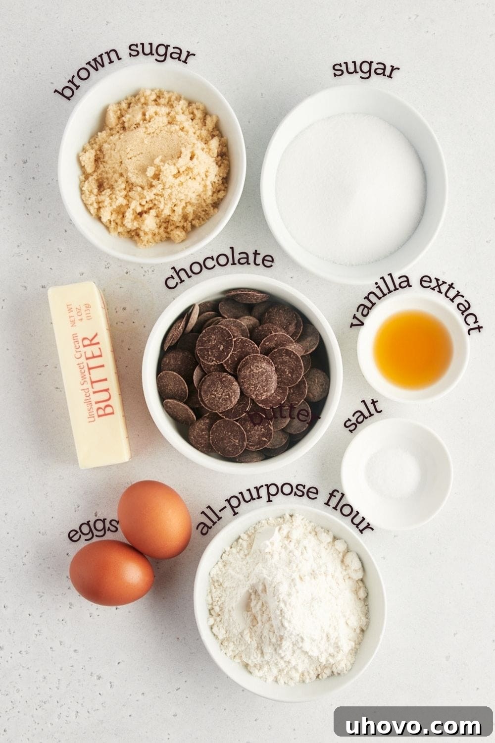 Overhead view of various ingredients for fudgy brownies laid out on a kitchen counter.