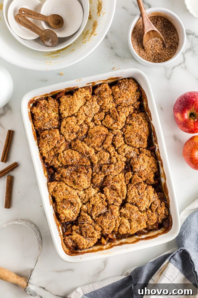 An exquisite overhead view of the freshly baked Brown Sugar Apple Cobbler, golden brown and bubbly, straight from the oven.