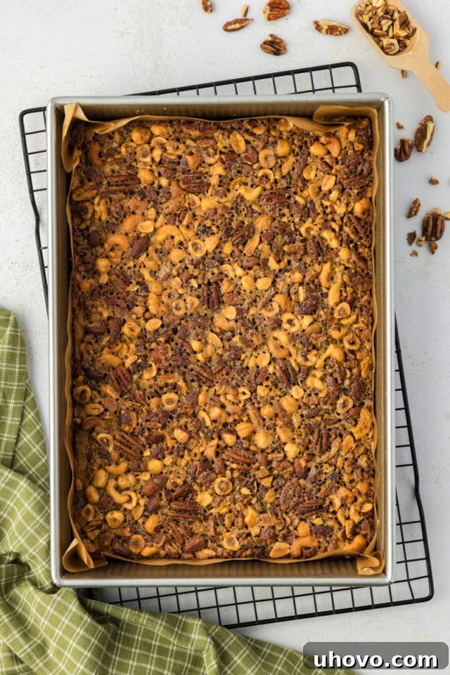 Overhead view of maple nut bars in parchment-lined pan