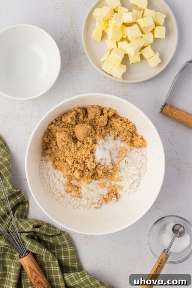 Overhead view of dry ingredients for crust in bowl before mixing