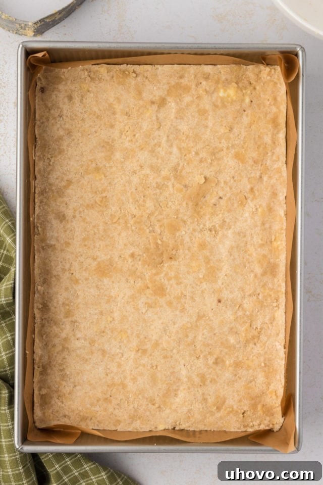 Overhead view of unbaked crust for maple nut bars