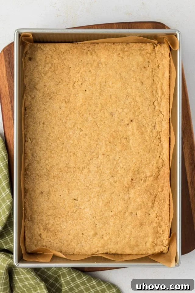 Overhead view of baked crust for maple nut bars