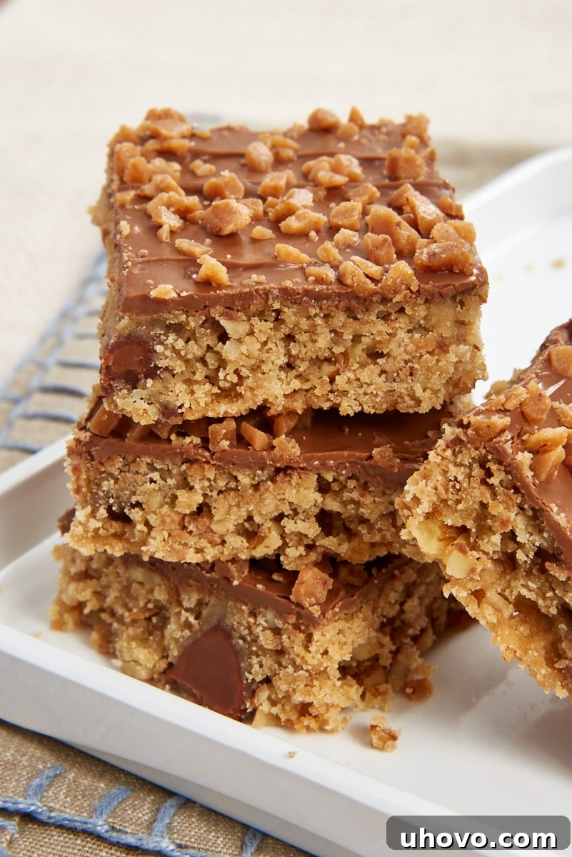 three Chocolate Toffee Bars stacked on a white tray