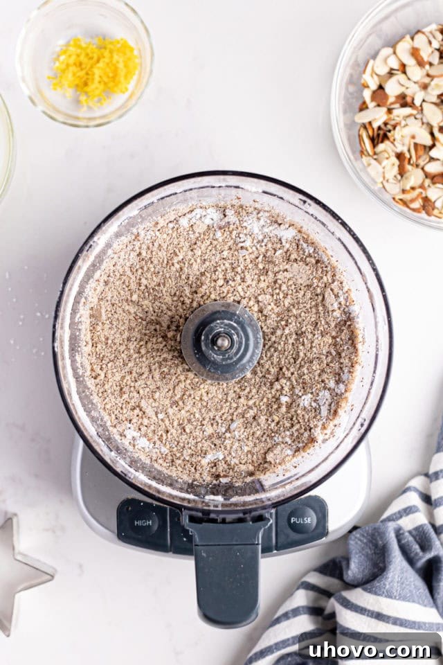 Ground almond mixture in food processor, showing the finely processed ingredients