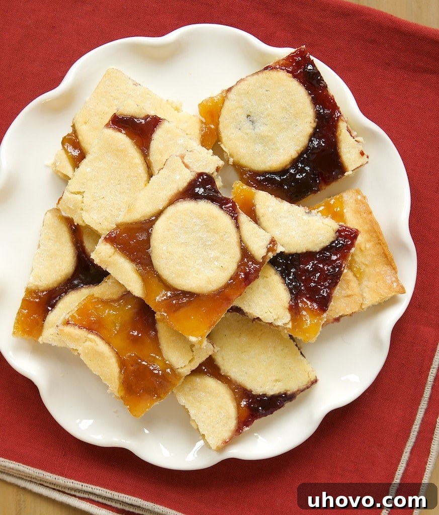 Linzer Bars, a simpler take on traditional Linzer Cookies, featuring a rich, almond-infused crust and vibrant fruit preserves.