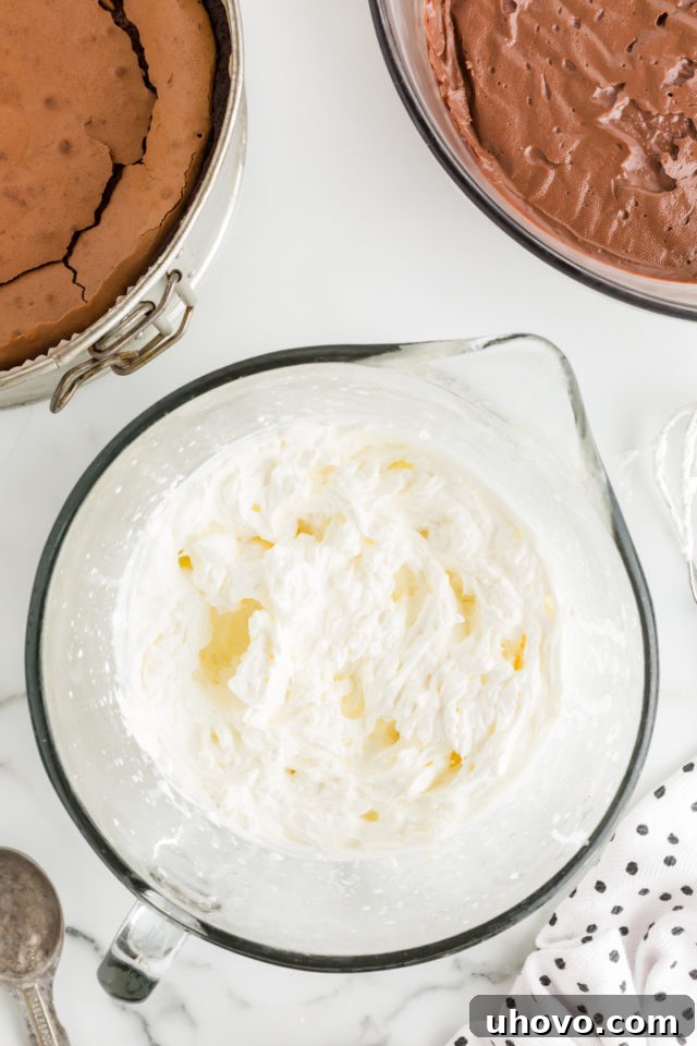 Overhead view of whipped cream in mixing bowl
