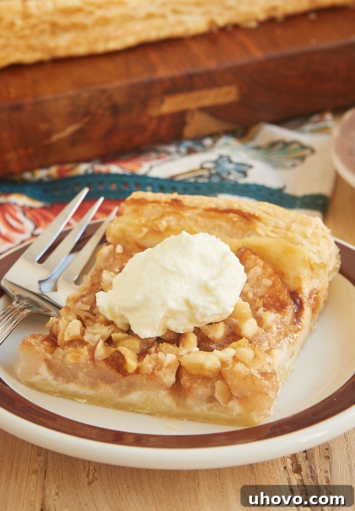Cream Cheese-Filled Pear Tart on a rustic surface.