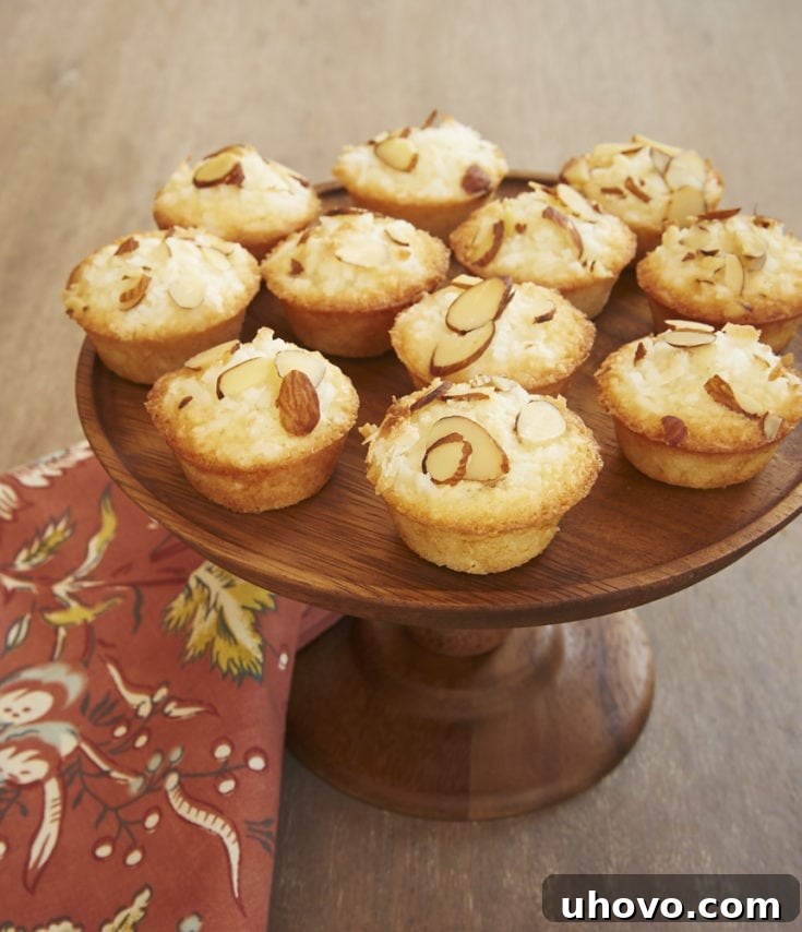 Delicious Mini Coconut Cakes with toasted almond and coconut topping.