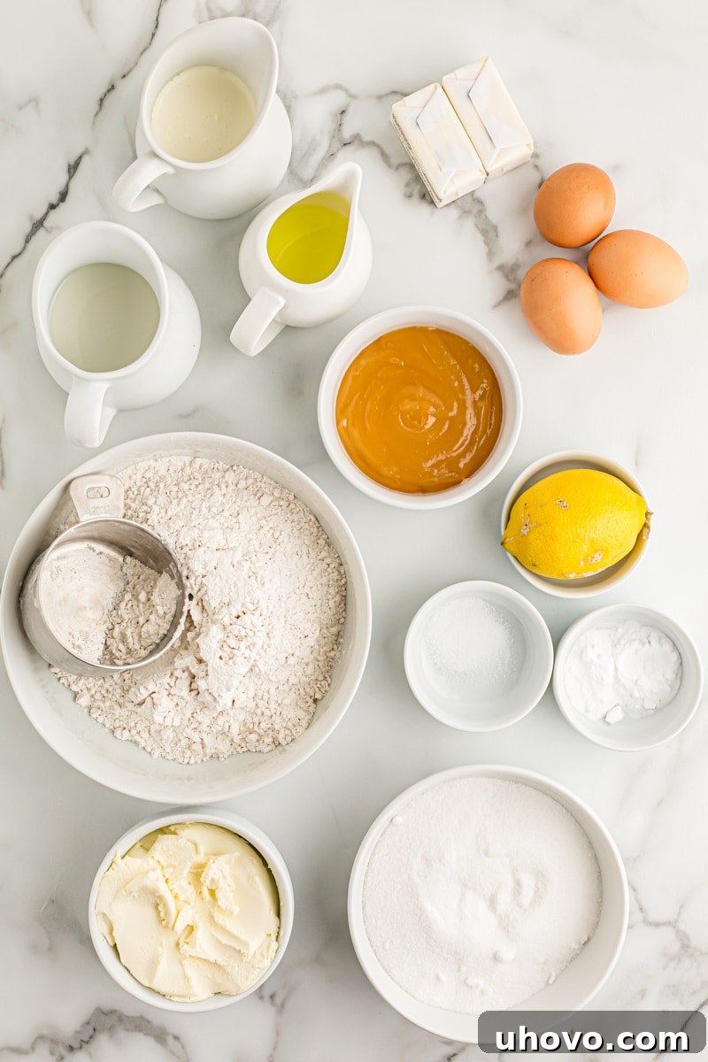 Overhead view of all the fresh ingredients laid out for making the lemon cream cake.