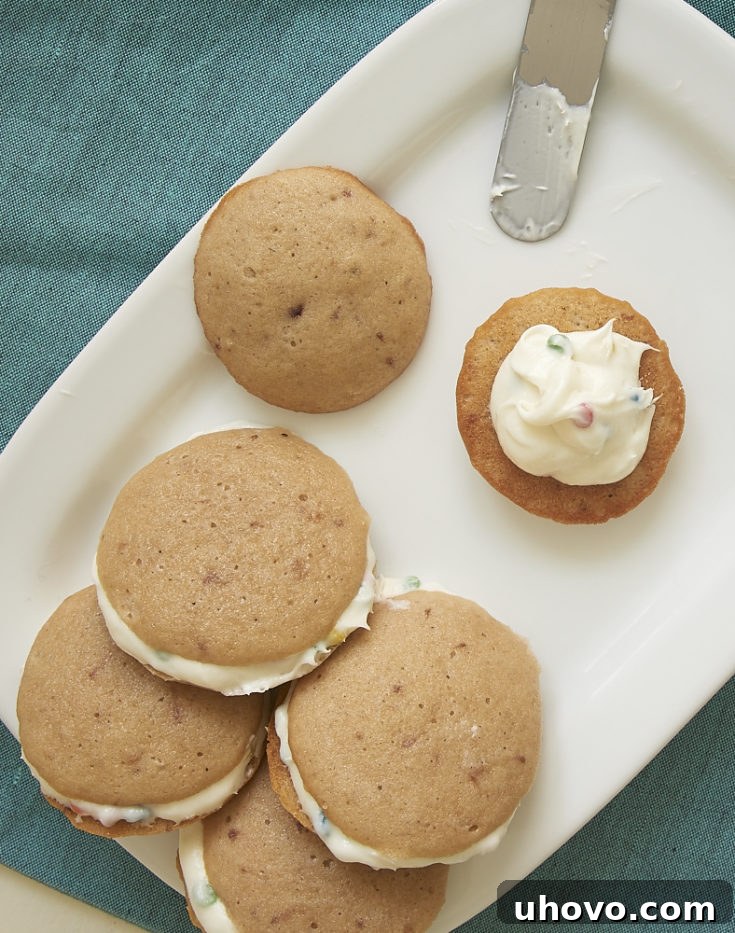 Little strawberry cakes are sandwiched around a sweet frosting for a fruity, handheld treat! - Bake or Break