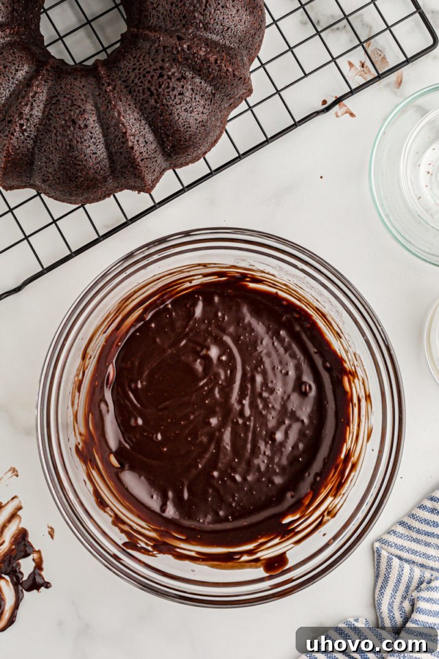 Overhead view of chocolate glaze in glass bowl