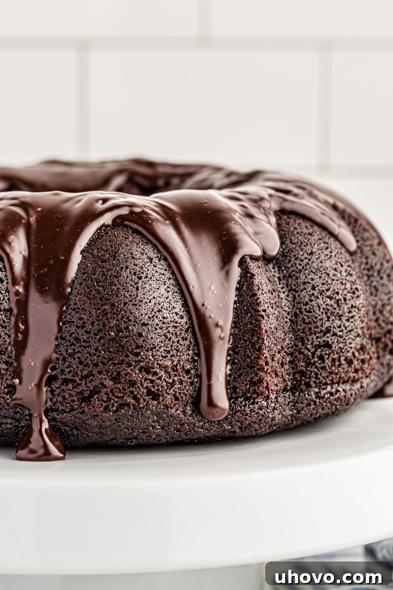 Whole chocolate sour cream Bundt cake with dripping glaze
