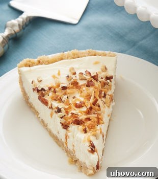 A single slice of Italian Cream Tart beautifully presented on a white plate, ready for tasting.