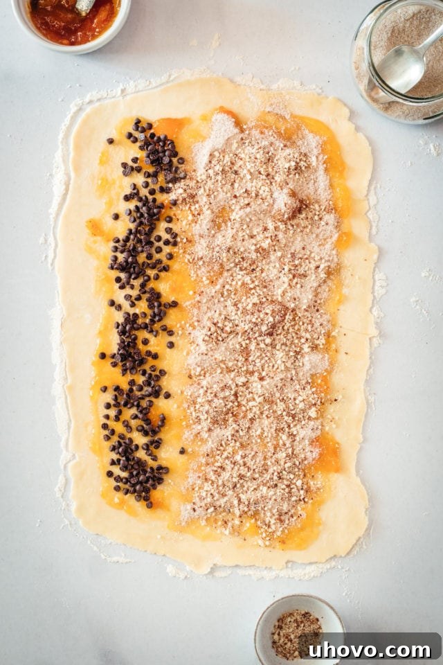 Rectangle of rugelach dough topped with filling ingredients