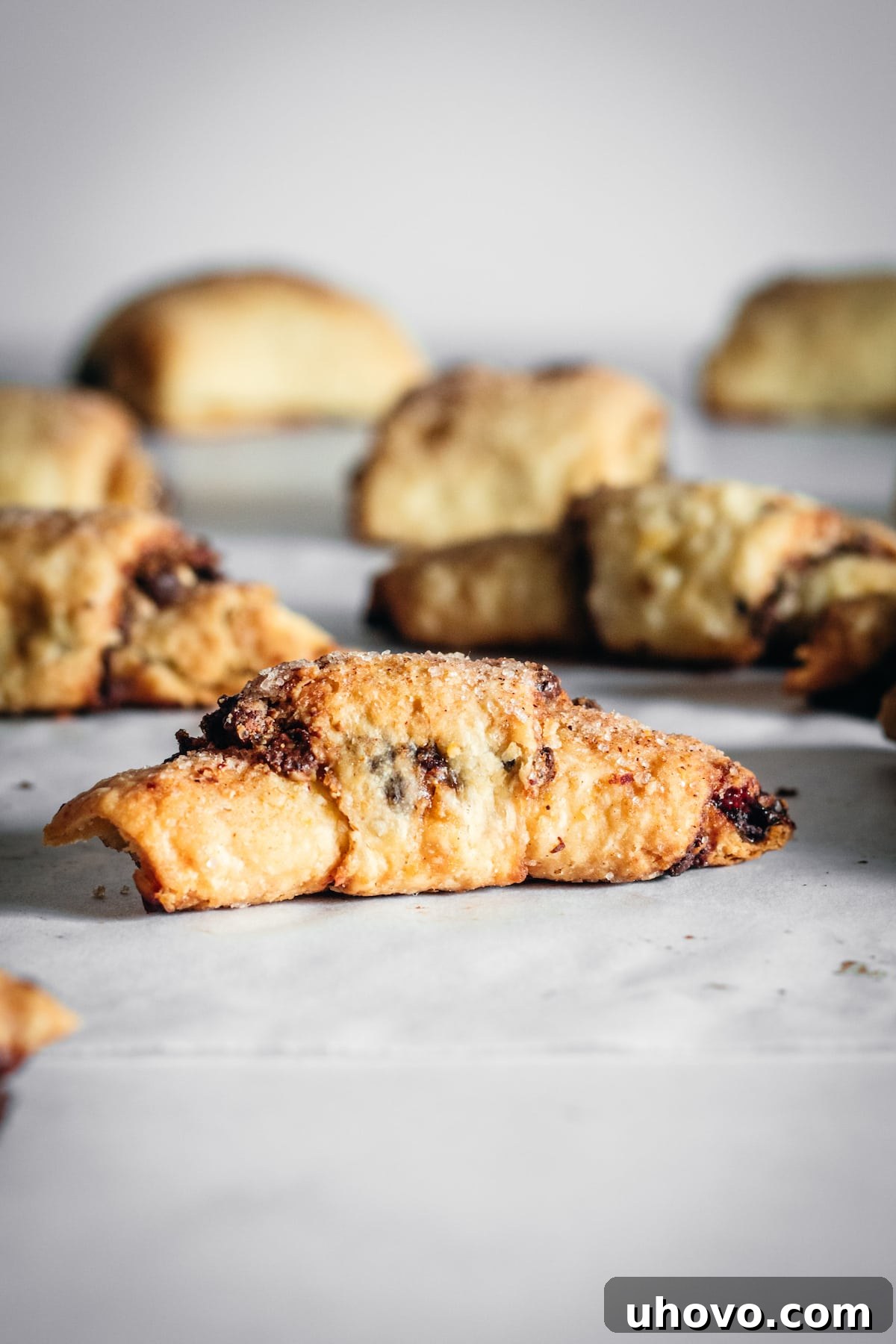 Crescent rugelach on parchment lined marble slab